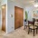 Dining area with a large closet and hallway leading to the bedroom