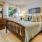 Bedroom with neutral wall paint and a large window