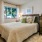 Bedroom with neutral wall paint and a large window